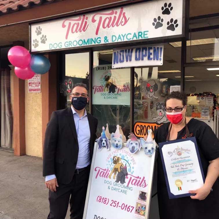 Tali Tails Dog Grooming and Daycare owner Tali with councilmember Bob Blumenfield